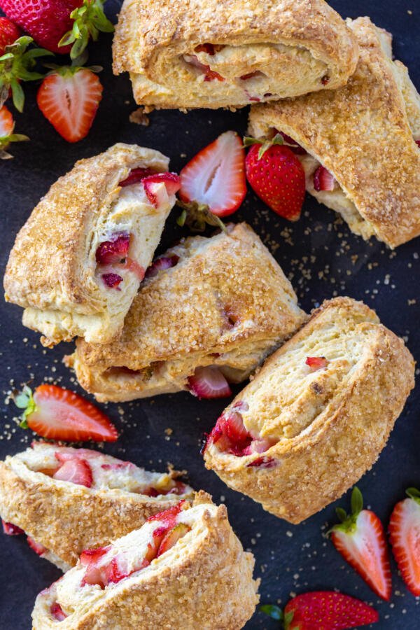 Strawberry scones on a serving tray with berries. 