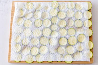 zucchini pieces on a paper towel