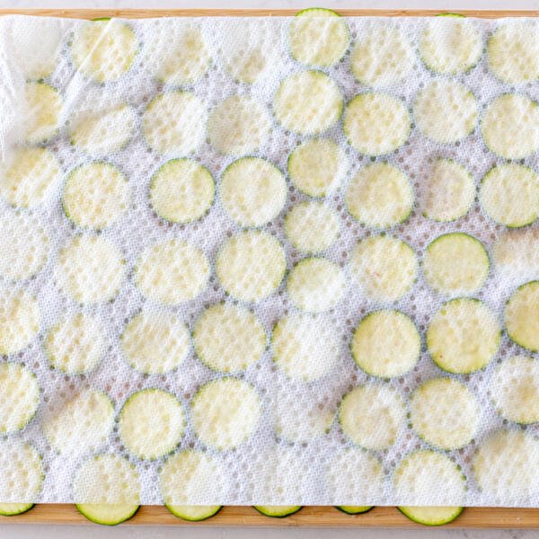 zucchini pieces on a paper towel