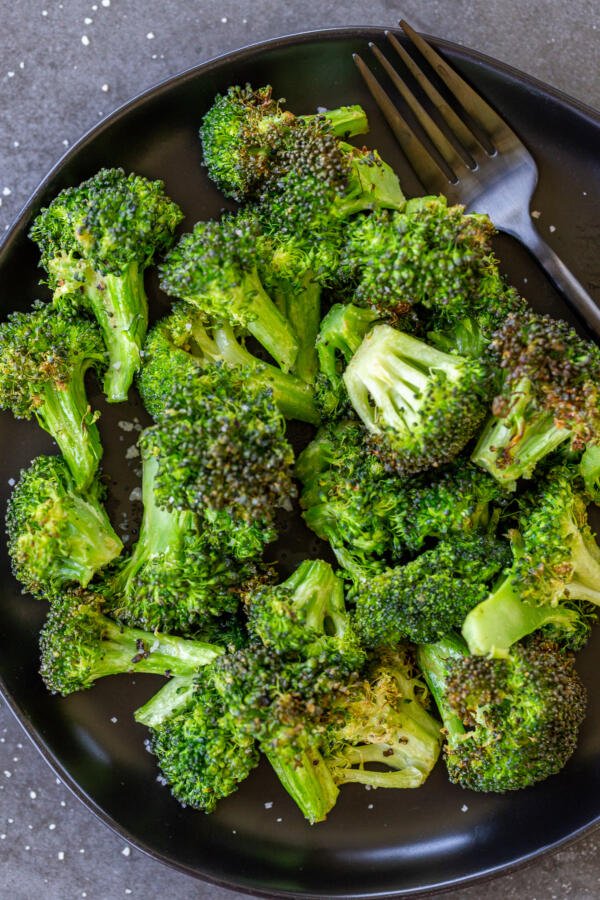 Broccoli on a plate with a fork