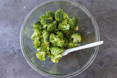 broccoli in a bowl with seasoning