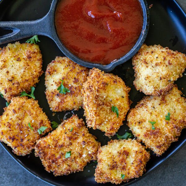 air fryer nuggets on a plate next to ketchup