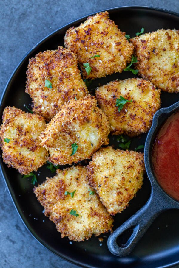 air fryer nuggets on a plate next to ketchup