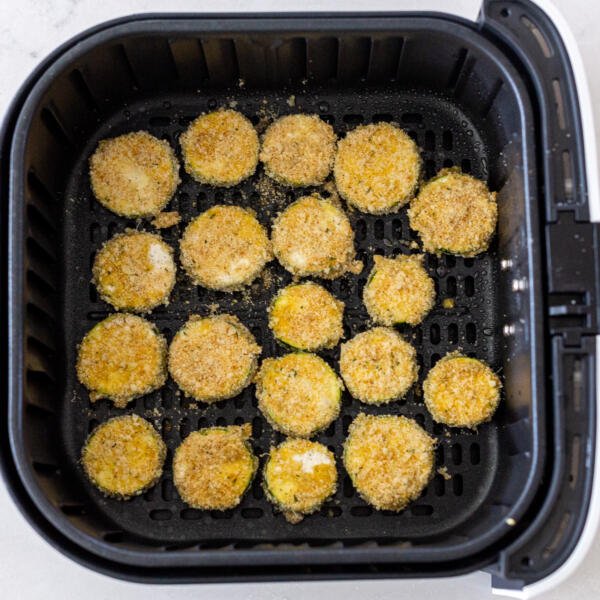 parmesan zucchini chips in air fryer basket