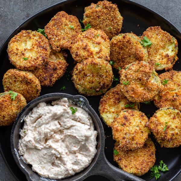 Air fryer parmesan chips on a plate with a dip