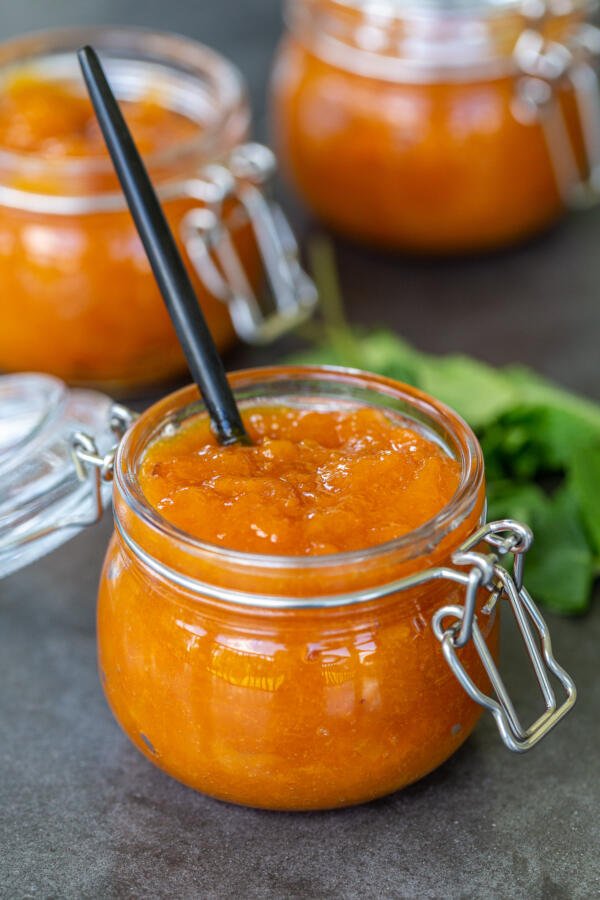 Apricot Jam in a jar with a spoon