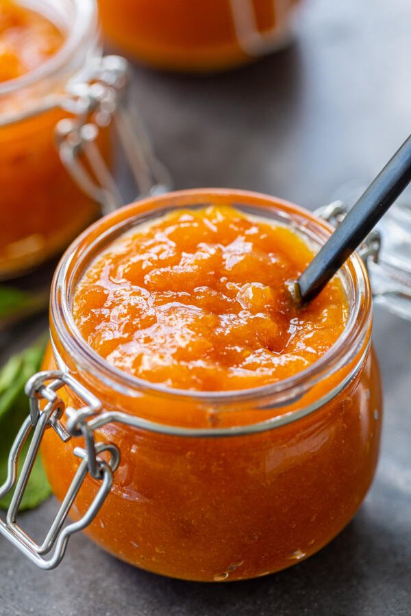 Apricot Jam in a jar with a spoon