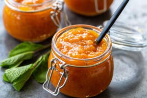 Apricot Jam in a jar with a spoon