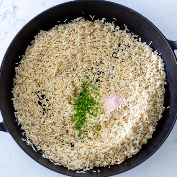 ricer with seasoning in a pot