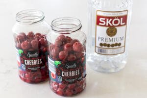 cherries with vodka next to it