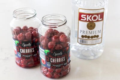 cherries with vodka next to it