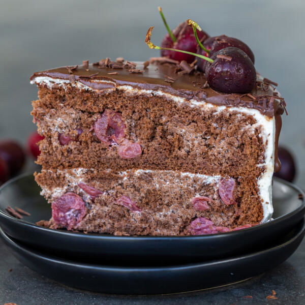A slice of drunken cherry cake on a plate