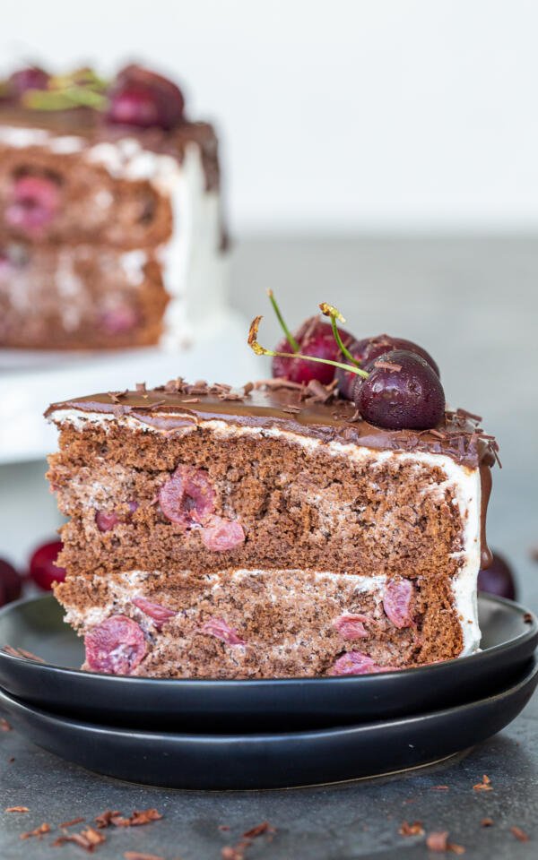 A slice of drunken cherry cake on a plate 