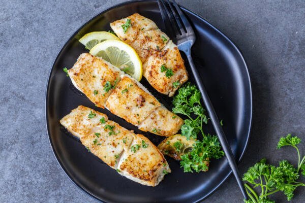 Halibut on a plate with herbs 