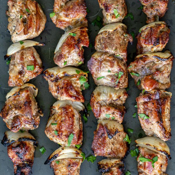 grilled pork kabobs on a serving tray