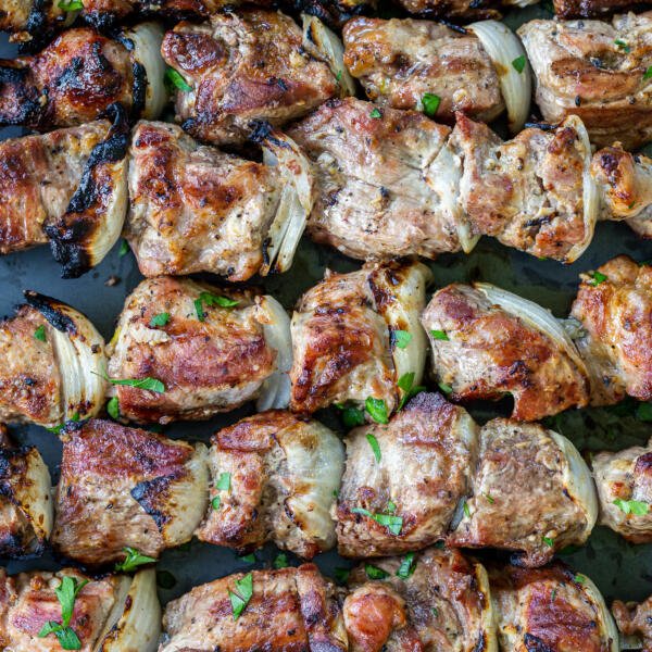 grilled pork kabobs on a serving tray