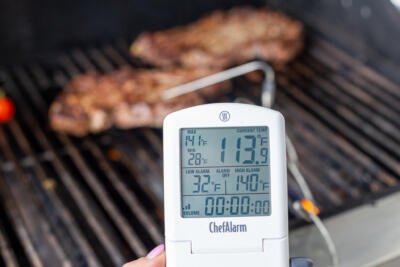 thermometer measuring temperature of the beef