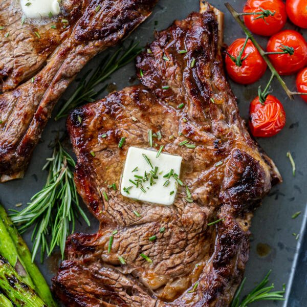 cooked ribeye with butter and veggies