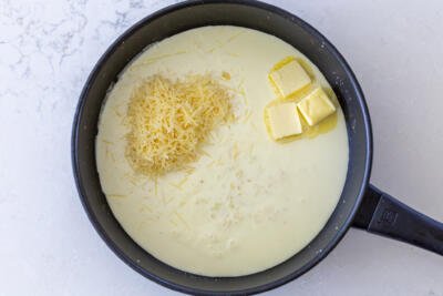 A pan with cream, parmesan and butter