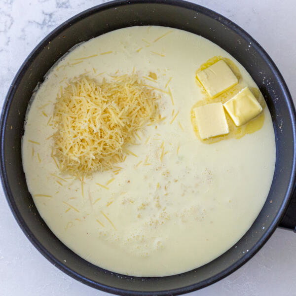 A pan with cream, parmesan and butter