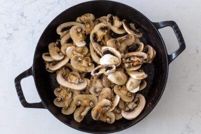 mushrooms sautéing in a pan