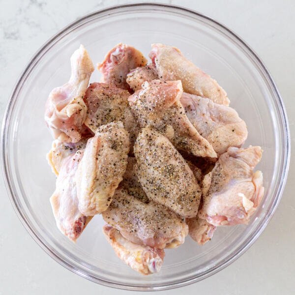 Seasoned chicken wings in a bowl