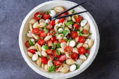 Caprese pasta salad in a bowl with