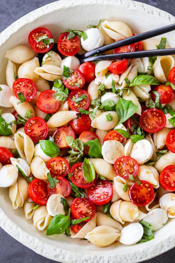 Caprese pasta salad in a bowl with 