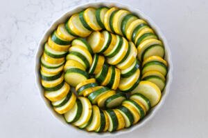 Lined zucchini and squash in a pan