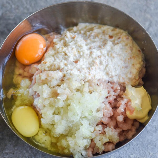 Meat, onion and eggs in a bowl