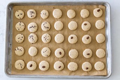 baked macarons on a baking sheet
