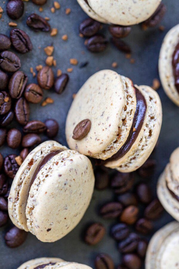 Coffee macarons on a pile of coffee beans