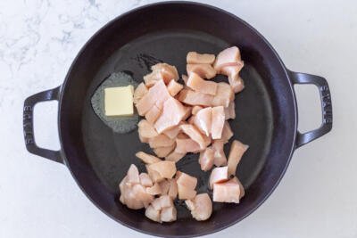 Chicken with butter in a pan