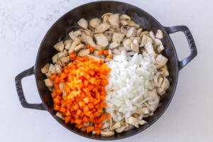 carrots and onion added in a pan