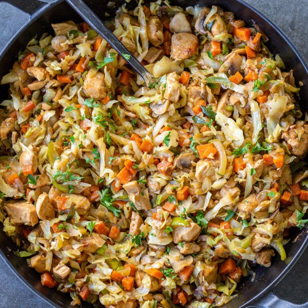 Braised cabbage with chicken in a pan