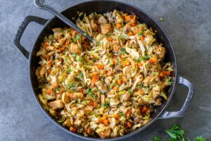 Braised cabbage with chicken in a pan