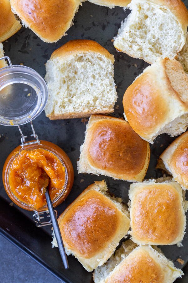 Dinner rolls with jam on a tray