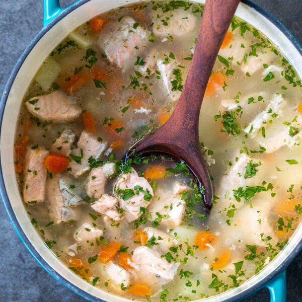 Ukha soup in a pot with a spoon