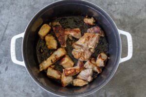 browned pork in a pot