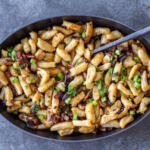 Halushki in a pan with a spoon