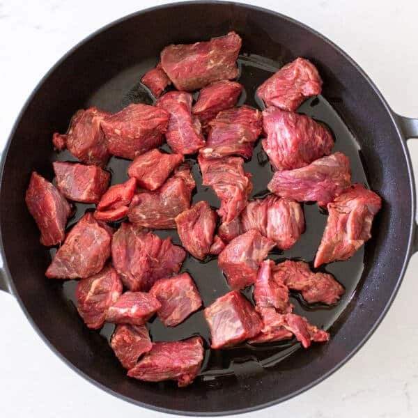 Beef cooking on a pan