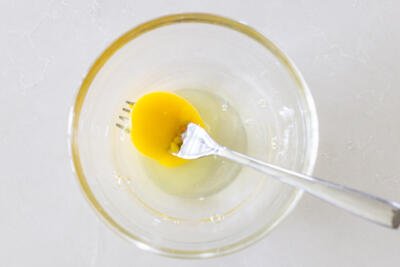 egg, water and vinegar in a bowl