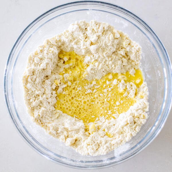dry ingredients with liquids and butter in a bowl