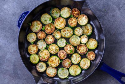 Browned zucchini in a frying pan