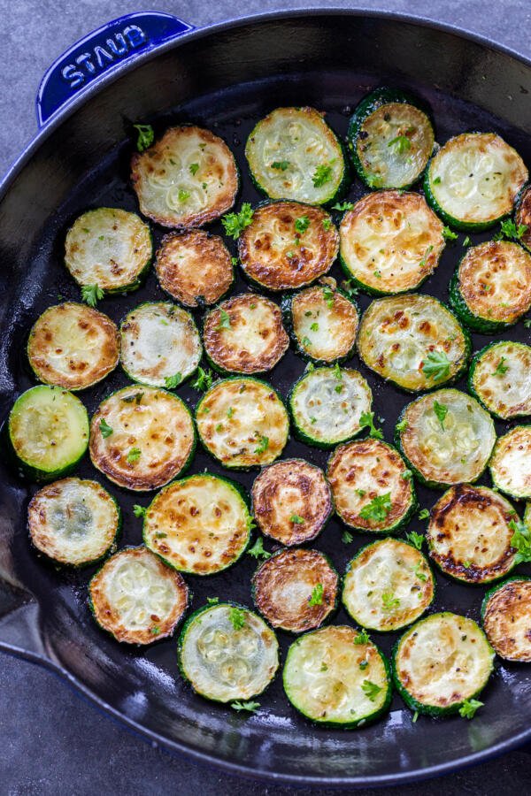 Browned zucchini in a frying pan