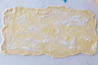 Rolled out dough with butter and sugar