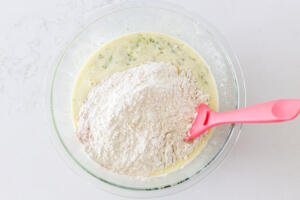 dry ingredients added to liquids in a bowl