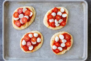 flatbread with sauce, cheese and tomato