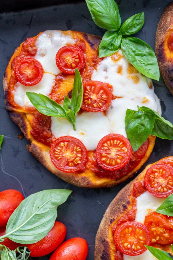 Baked Margherita Flatbread Pizza on a serving tray