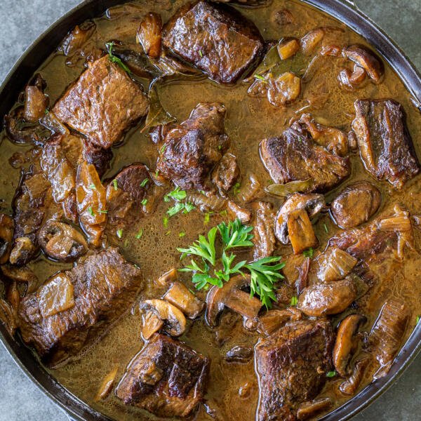 braised beef with mushrooms in a pot